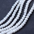 Kép 2/2 - Üveggyöngy - 10x8mm - csiszolt - fánk alakú - fehér színben (10db)