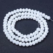 Kép 1/2 - Üveggyöngy - 10x8mm - csiszolt - fánk alakú - fehér színben (10db)