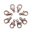 Kép 1/4 - Kapocs - 10x6mm - delfin - vörösréz színben - Nikkelmentes! 