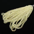 Kép 2/2 - Üveggyöngy - 6x4mm - áttetsző citrom színben - fánk alakú csiszolt