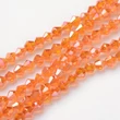 Kép 1/2 - Üveggyöngy - 2x3mm - áttetsző sötét narancs AB - bicone alakú csiszolt