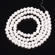 Kép 1/2 - Üveggyöngy - 4,5x4mm - csiszolt bicone - elefántcsont színben