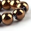 Kép 4/4 - Üveggyöngy - kerekek, rézbevonatúak, 7,5x8,5 mm (10db)