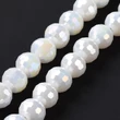 Kép 3/4 - Üveggyöngy - AB színű bevonattal, csiszolt, kerek, fehér, 7–8 mm
