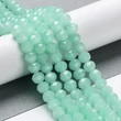 Kép 1/5 - Csiszolt - üveggyöngy - 10x8mm - Csillogó halvány türkiz - fánk alakú (10db)