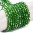 Kép 1/4 - Üveggyöngy - csiszolt - fánk alakú 4x3mm - Zöld színben