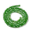 Kép 2/4 - Üveggyöngy - csiszolt - fánk alakú 4x3mm - Zöld színben