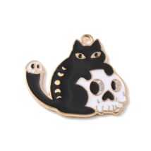 Medál - fekete macska - fehér koponyával - arany színben