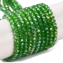 Üveggyöngy - csiszolt - fánk alakú 4x3mm - Zöld színben