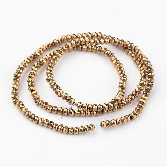 Üveggyöngy - 3x2mm - arany színben - fánk alakú csiszolt 